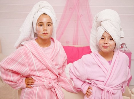 two girls wearing a large towel turban
