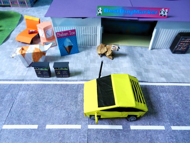 papierkunst auto in een stad van papier papierkunst auto in een stad van papier