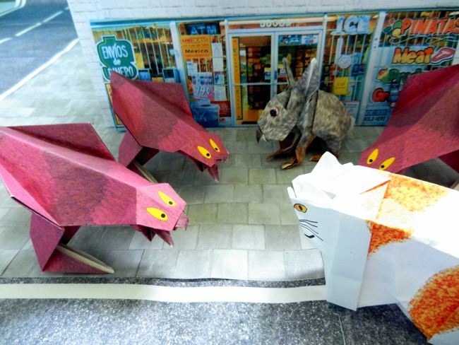papierkunst monstertjes die een konijn en poes bedreigen papierkunst monstertjes die een konijn en poes bedreigen