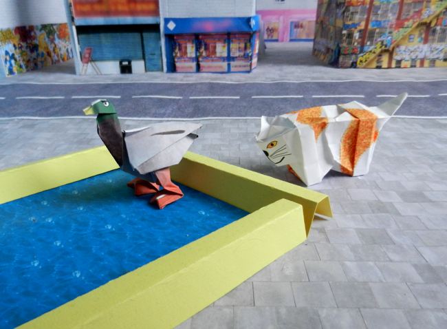 origami eend in een vijvertje van papierkunst origami eend in een vijvertje van papierkunst