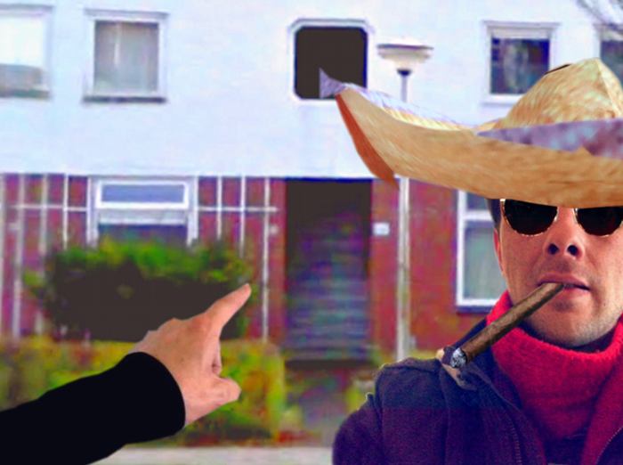 man with sunglasses and origami sombrero