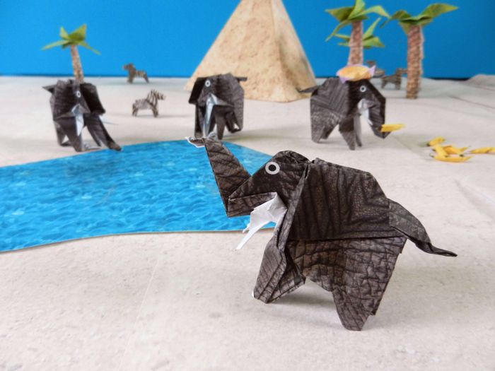 origami elephants at a lake in a desert origami elephants at a lake in a desert